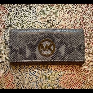 Michael Kors python embossed wallet.